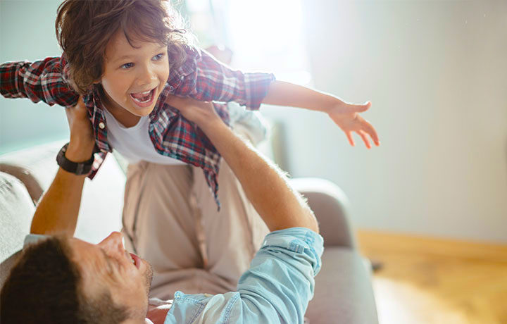 Father and son playing