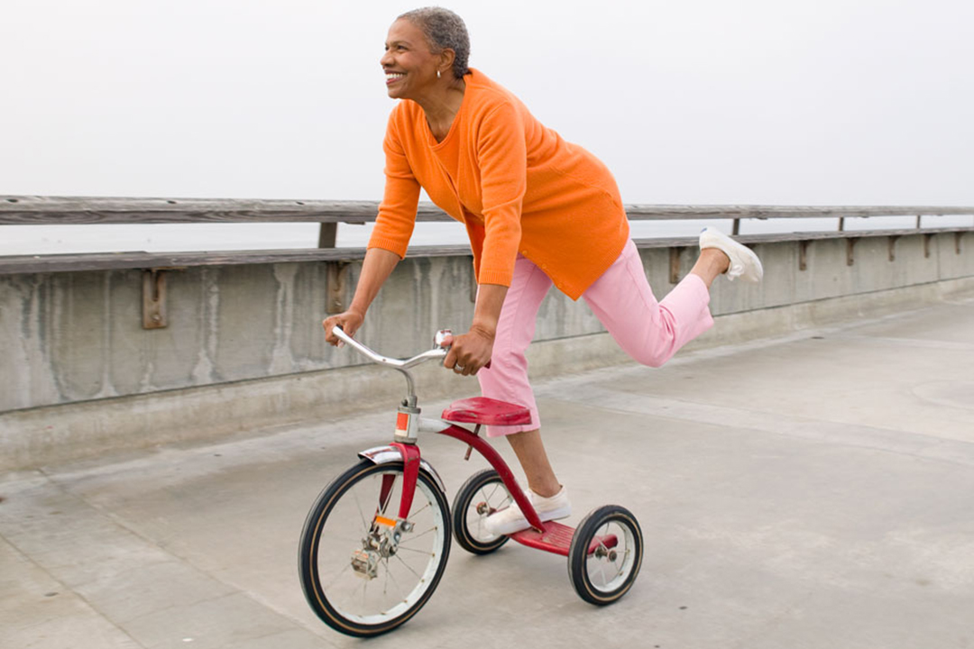 woman riding tricycle